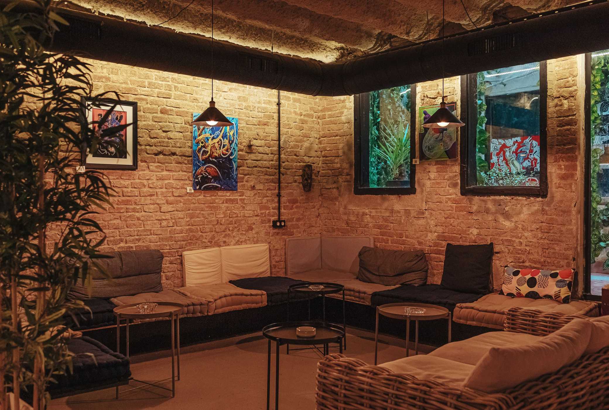 Soft sofas for relaxing in weed cafe La Orquesta