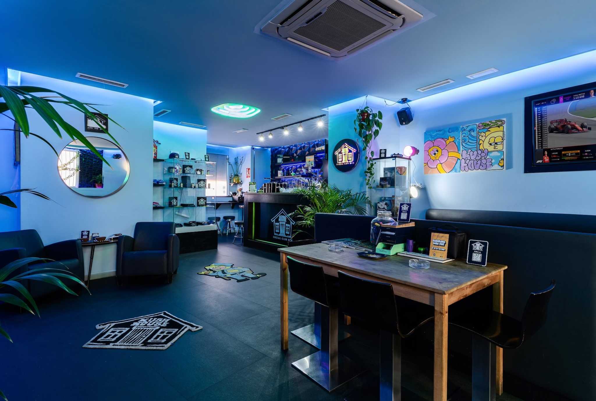 Spacious modern lounge with neon accents in the Kush House social club Barcelona