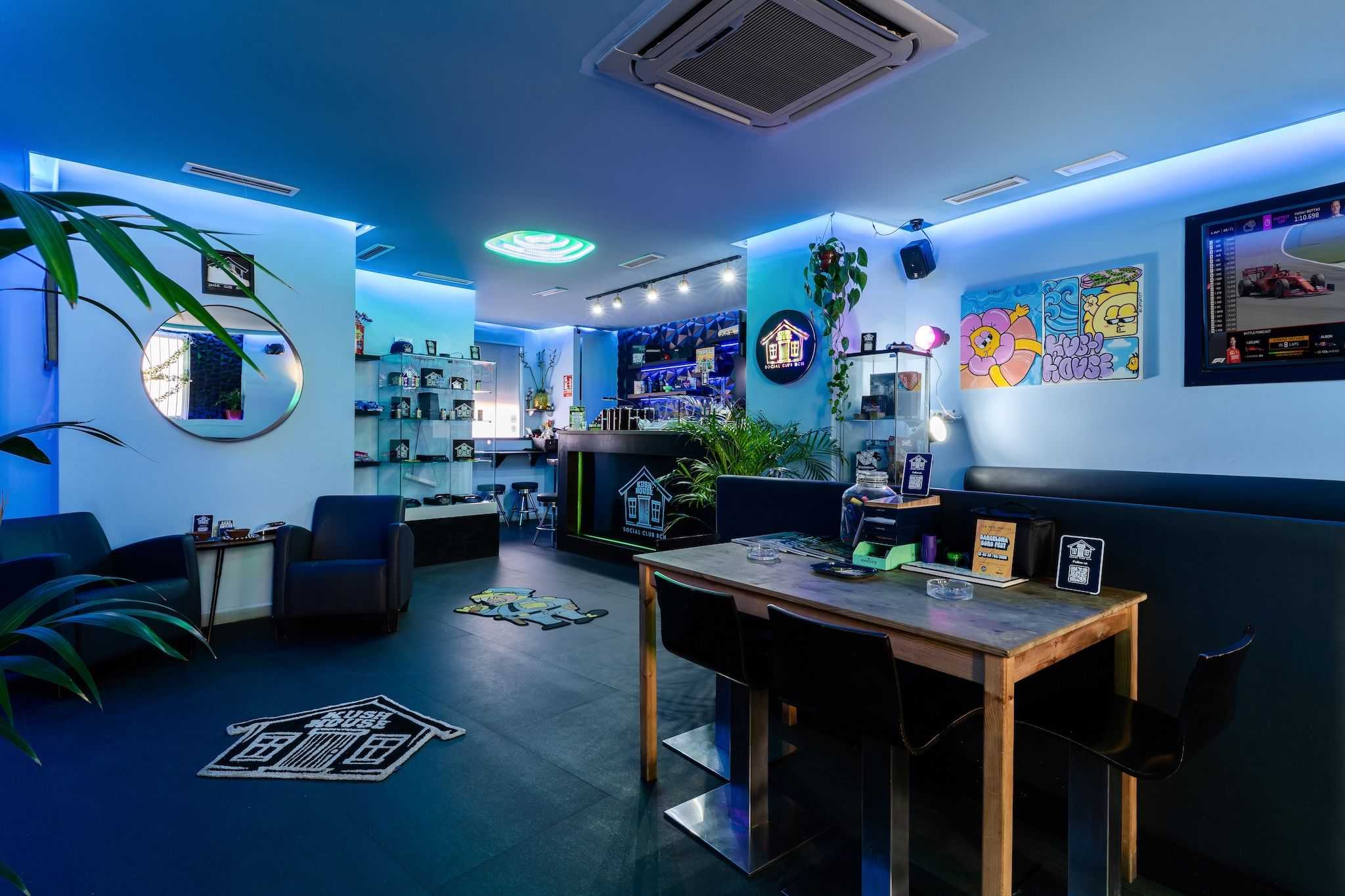 Spacious modern lounge with neon accents in the Kush House social club Barcelona